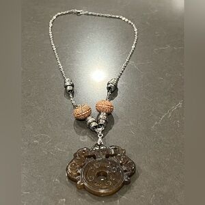 Silver Chain necklace,  featuring a carved jade pendant and decorative beads